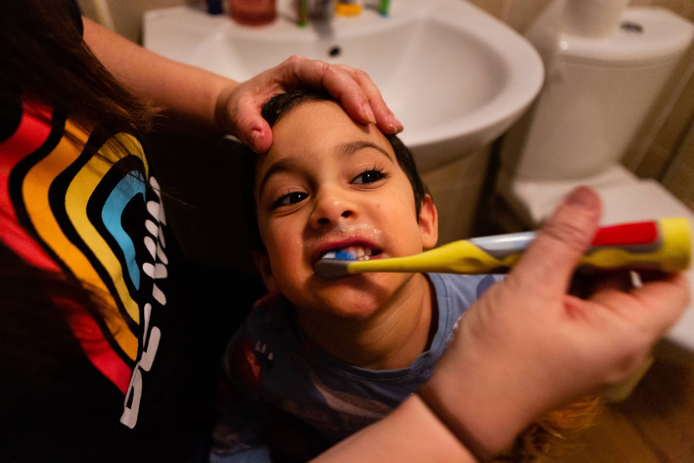 A mother brushing her young son's teeth | Rose Dedman Photography, Bristol