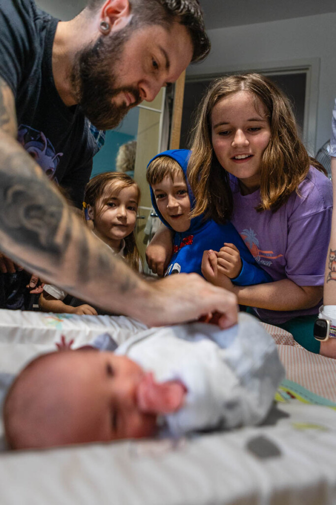 Children meeting their baby cousin for the firs time | Family photographer Bristol