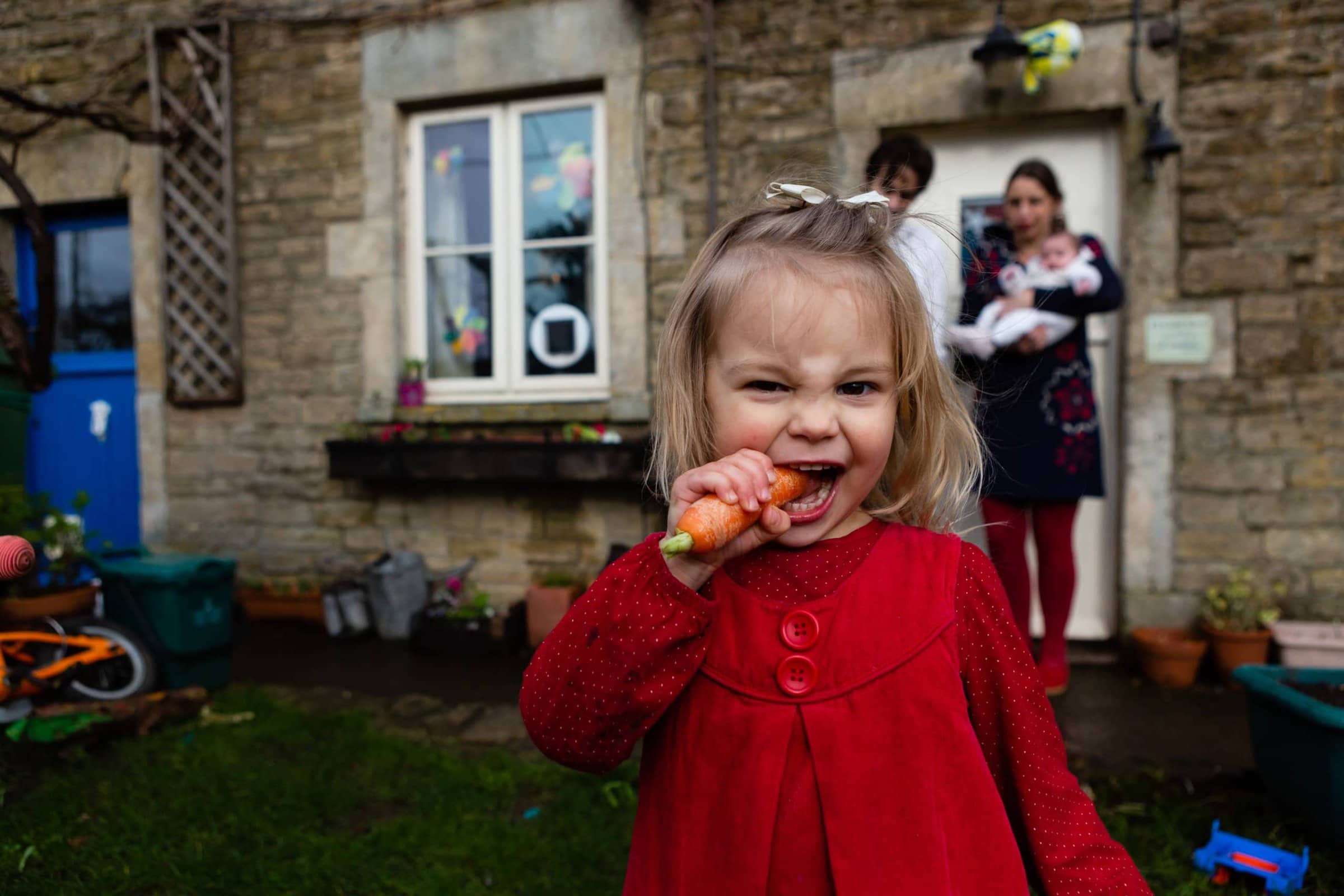Little girl eating a carrot | Family Photographer Bath & Bristol