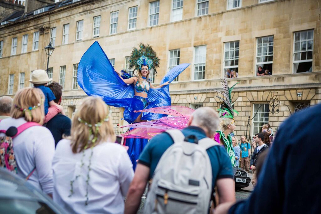 Image of a lady on stilts in Bath Carnival | Event Photographer Bath Bristol | Rose Dedman