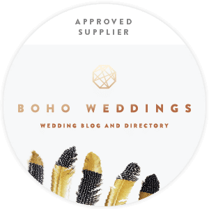 Boho Weddings approved supplier badge with feathers.