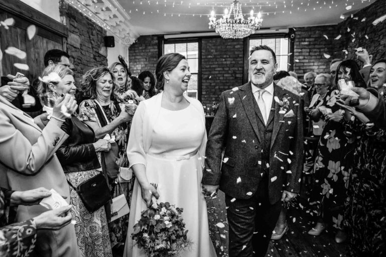 Bride and Groom having confecting thrown at them at their Radnor Rooms wedding | Bristol wedding photographer
