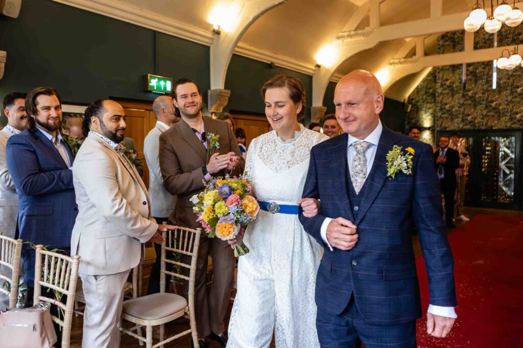Bride walks down the aisle at The Hare and Hounds Tetbury | Wedding Photos