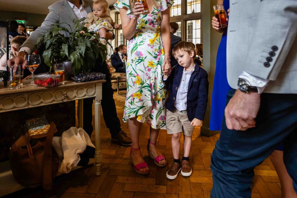 Little boy looking bored at The Hare and Hounds Tetbury | Wedding Photos