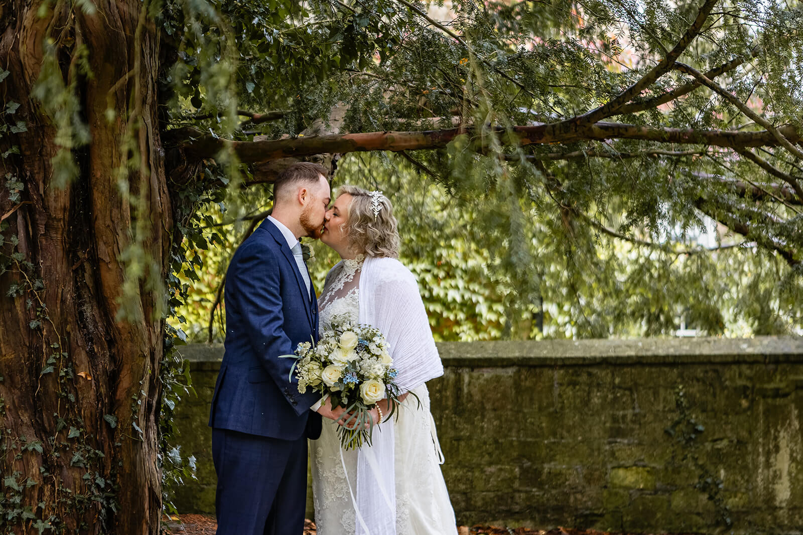 Wedding couple kissing after their wedding in St Thomas à Becket church in Widcombe | Church Wedding Bath 