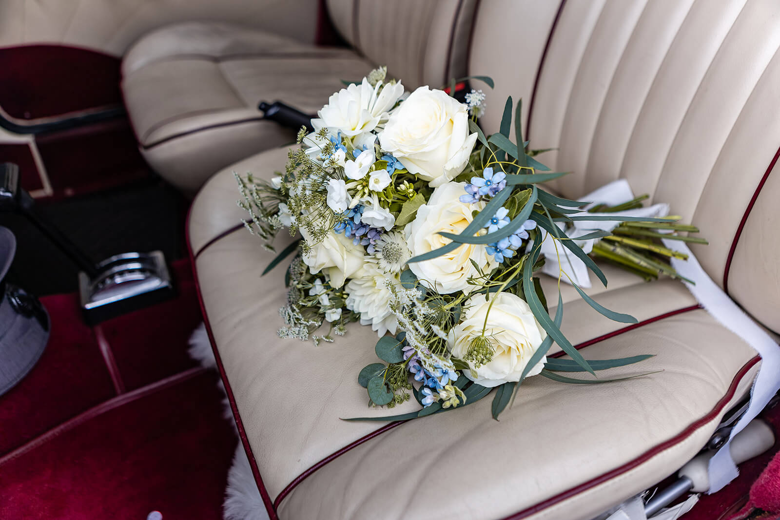 Bridal bouquet on the chair of the wedding car | Church Wedding Bath