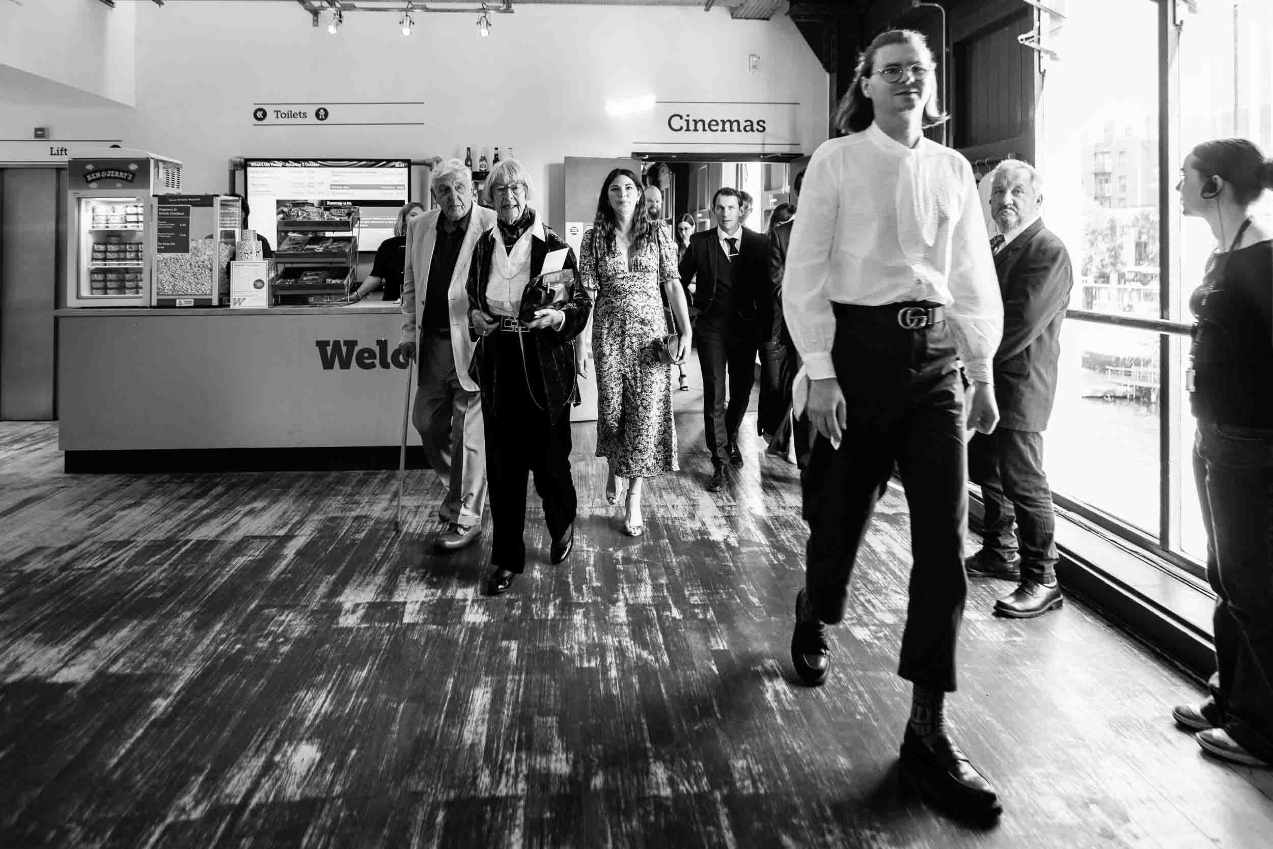 Guests exit quirky cinema wedding Bristol | Wedding Photographer