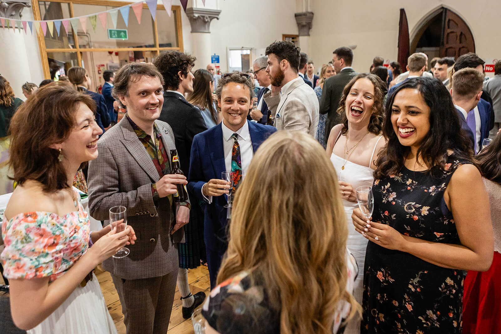 Wedding guests inside the Elmgrove Centre Bristol| Wedding Photographer