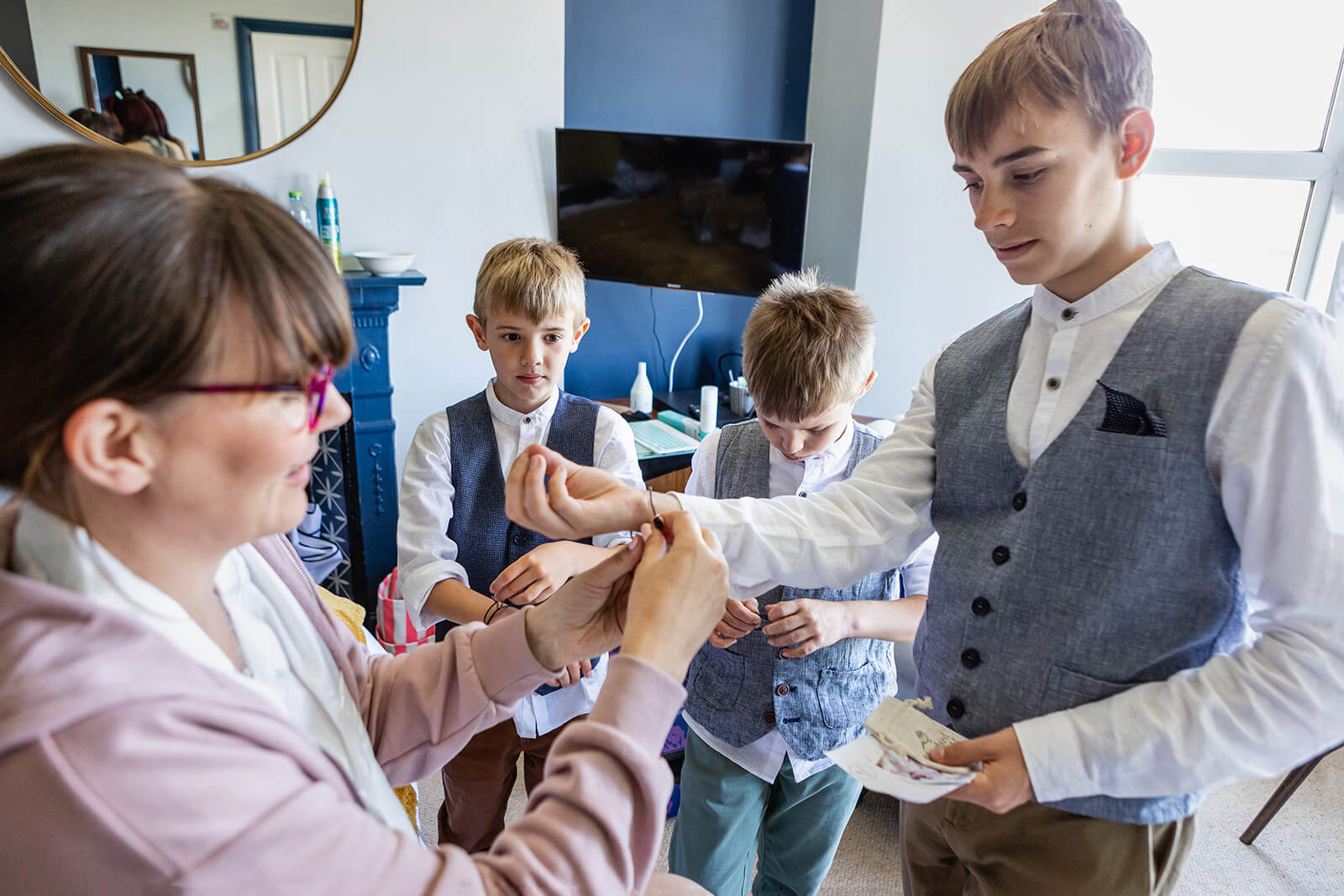 Bride giving her sons special bracelets | Rose Dedman Wedding Photographer UK
