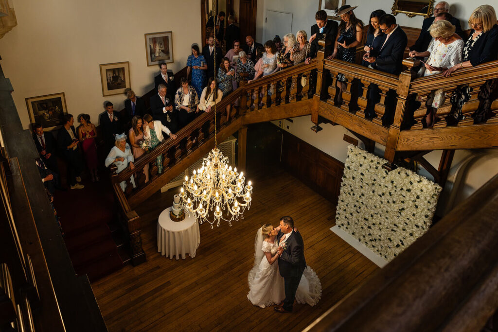 Couple's first dance at wedding with guests watching. Coombe Lodge Wedding Photographer (this is not Coombe Lodge).