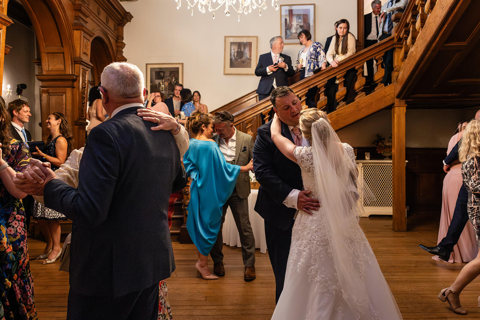 Couples dancing at wedding reception inside Holmewood Hall.