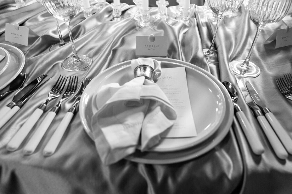 Elegant table setting with menu and napkin.