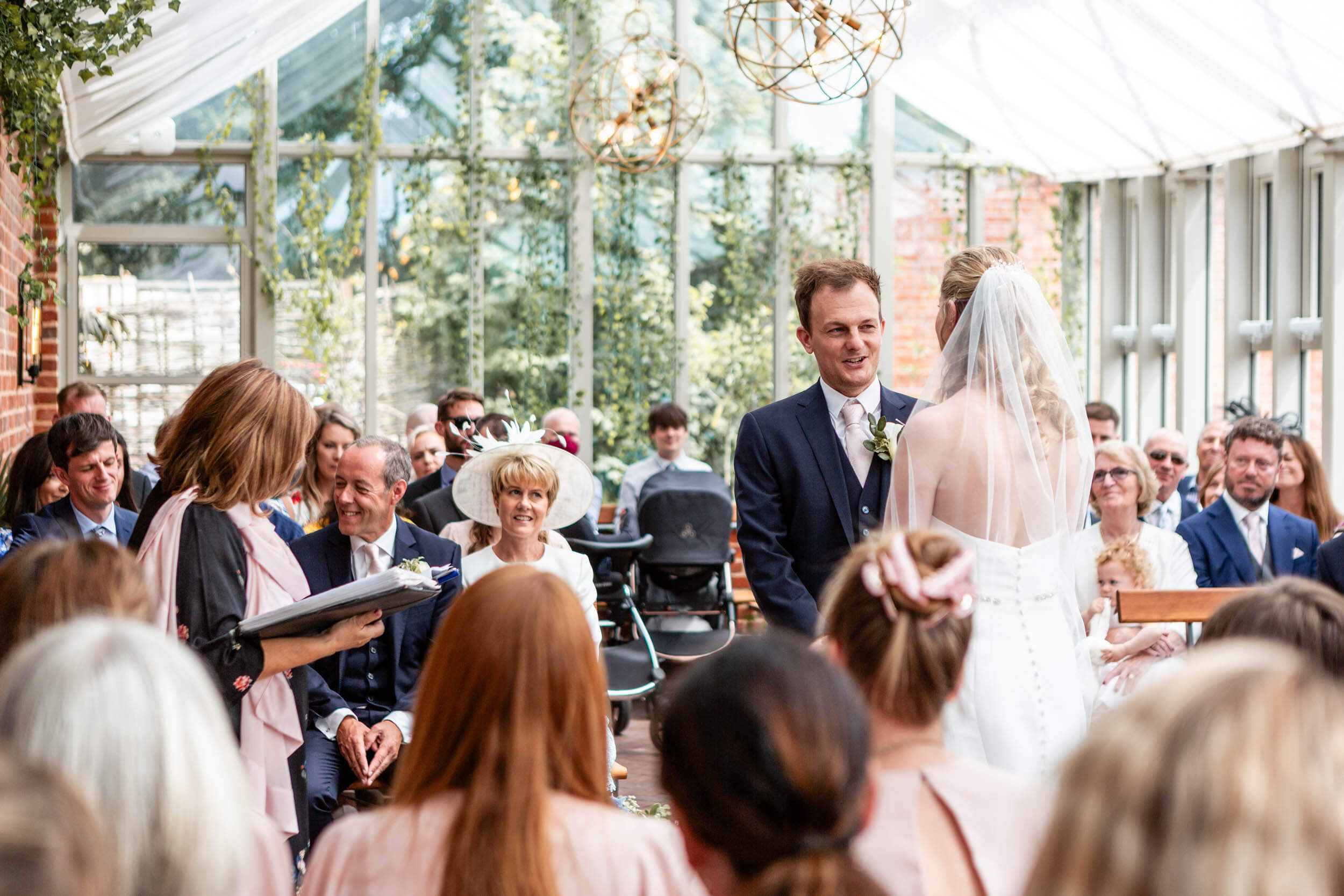 Couple exchanging vows during a Syrencot House wedding ceremony | Syrencot Wedding Photographer