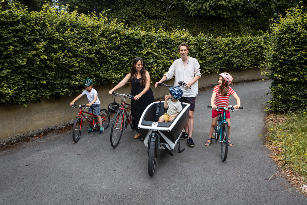 Family cycling together on a sunny day