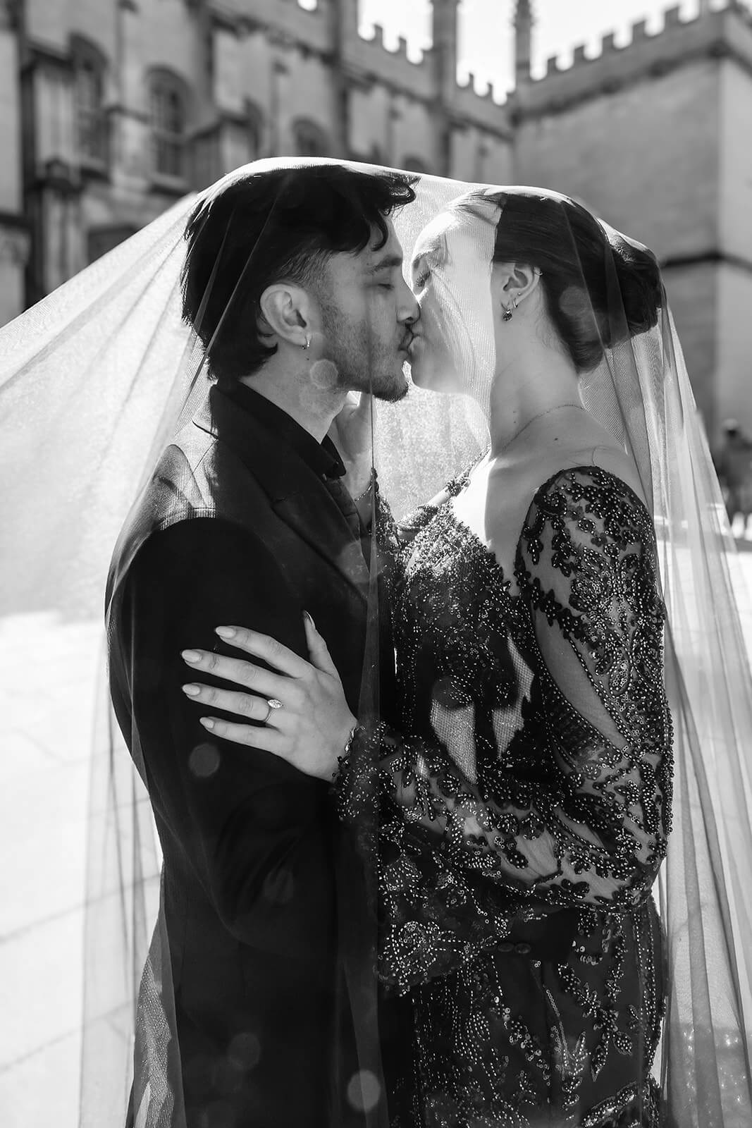 Bride and groom kissing under a veil outdoors | Oxford Nikkah Wedding Photos