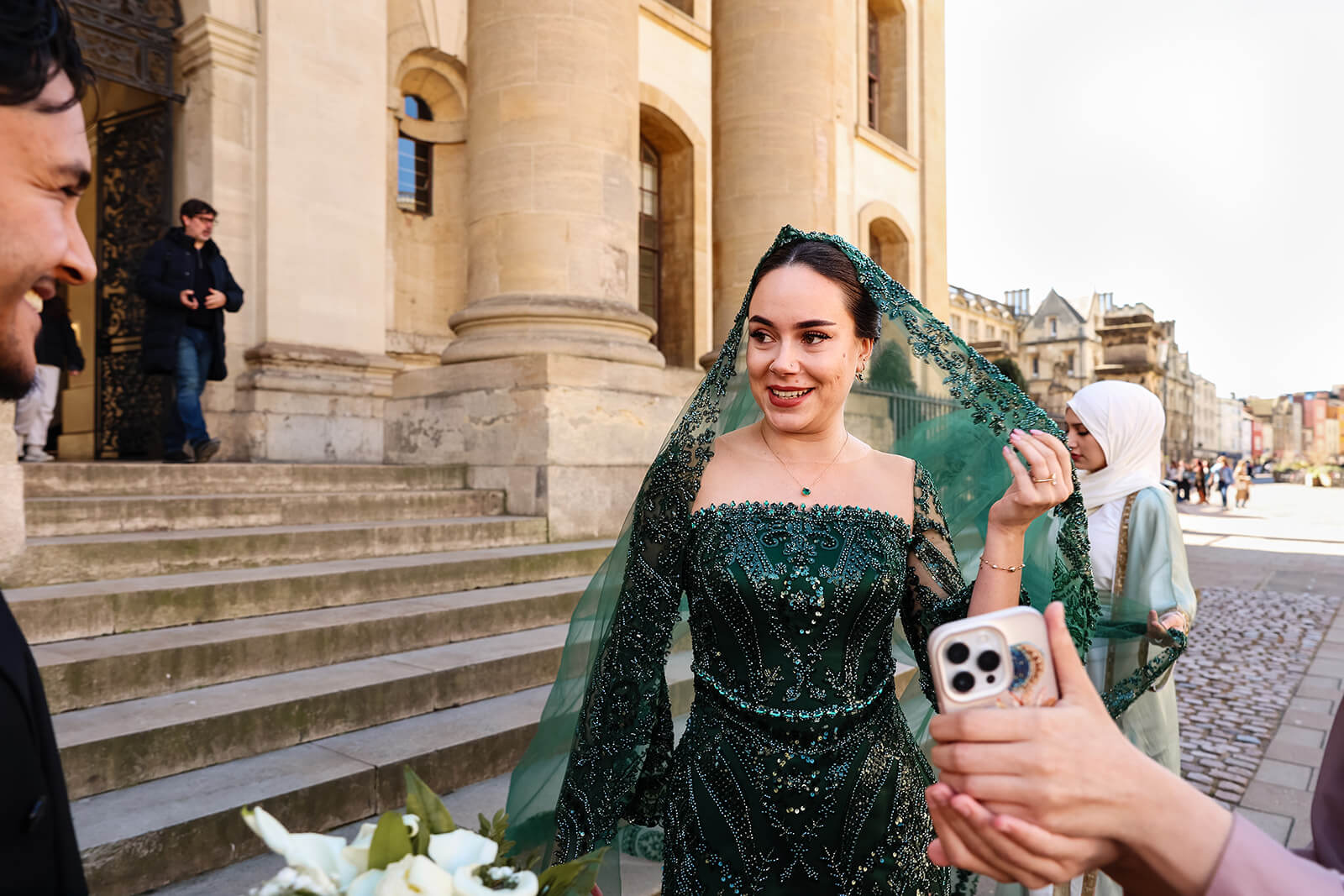 Woman in elegant green Nikkah dress looking at her husband to be | Oxford Nikkah Wedding Photos