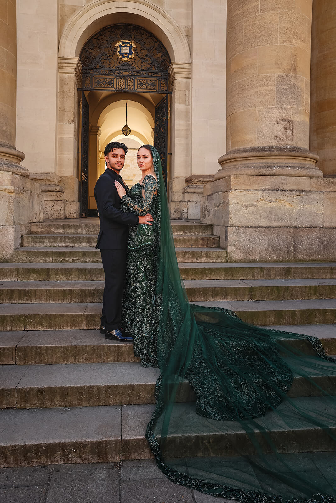 Elegant Nikkah couple on steps in formal attire in central Oxford | Oxford Nikkah Wedding Photos
